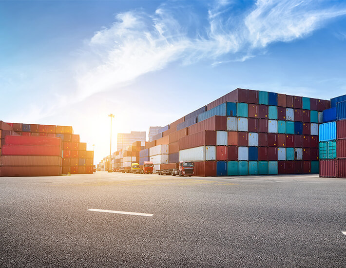 Image of containers in a sunset